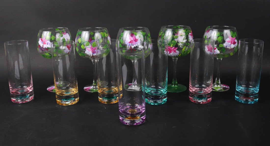 Group of Tinted and Painted Glassware: Comprising five floral-painted wine glasses and seven colored glass highball glasses, 12 pieces total Wine glasses: 7-1/2"h Highball glasses: 7"h Provenance: Property from a New York City Gentleman