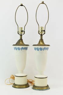 Pair of Wedgwood Queensware Urns Mounted as Lamps: Pair of Wedgwood Queensware Urns Mounted as Lamps having off white ground with wedgwood blue grape and vine pattern below rim mounted on cylindrical metal risers with brass base and top; used conditio