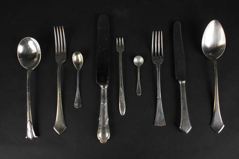 Large Group of Silver Plated Flatware: Including thirteen Reed and Barton medallion decorated serving spoons, and forks, and spoons of many makers.