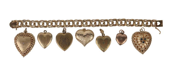 14K Yellow Gold Charm Bracelet Heart Motif: Bracelet, 7"l together with seven yellow gold heart form charm/pendants, total gross weight approx. 42.4dwt.