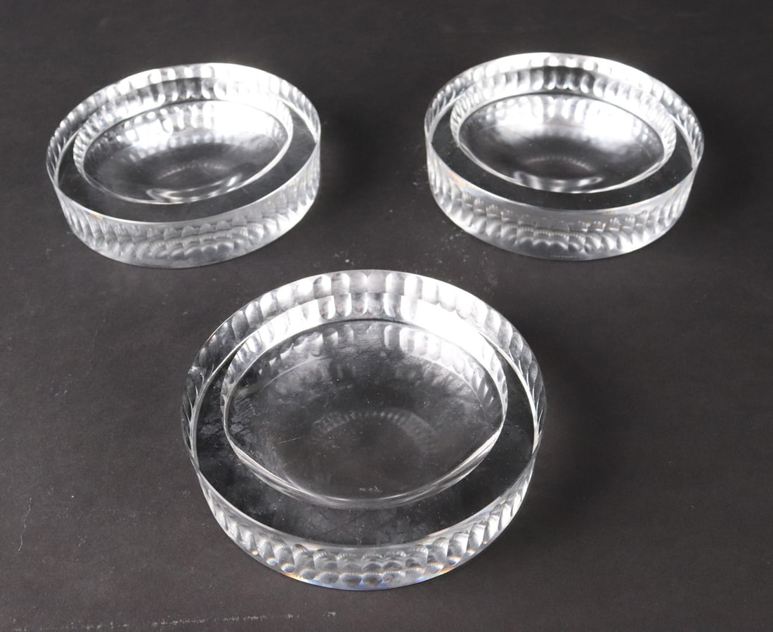 Three Tiffany & Co. Crystal Ashtrays: 3 pieces. 1-1/4"h x 5-1/2" dia Provenance: Property from a Private New York and Switzerland Collection
