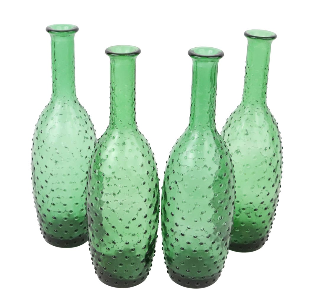 Four Hobnail Green Glass Bottles: 20th C. Some wear. 10-3/4"h Provenance: Property formerly in the collection of Ian and Carolina Irving, The Famous and Well Known Textile Designer and Taste Maker, Some Featured in World of Interiors,