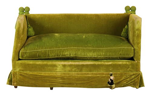 Green Velvet Upholstered Knole Settee: 20th C. One finial loose, wear and losses to fabric. Distressed. 34"h x 4'6"l x 27-1/2"w Provenance: Estate of Cora Ginsburg; Property formerly in the collection of Ian and Carolina Irving, The Famous