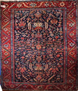 Heriz Carpet: Northwest Persia, c. 1925Hole to one corner, minor end losses, minor moth damage, minor wear. 11'9"l x 9'2"w Provenance: Property formerly in the collection of Ian and Carolina Irving, The Famous and