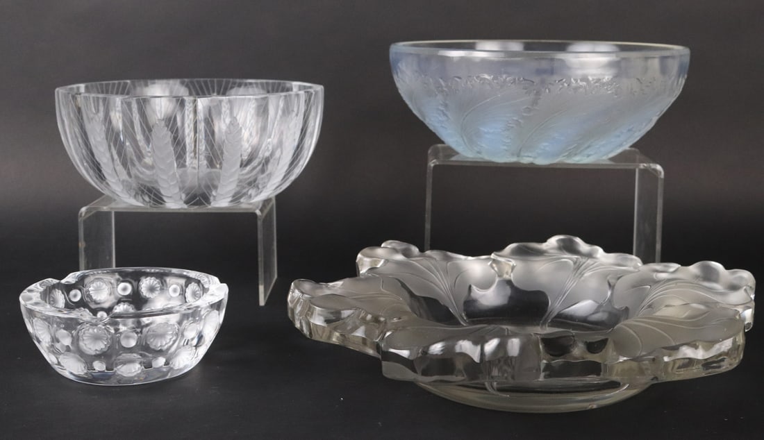 Four Lalique Colorless and Frosted Glass Bowls: 20th/21st C. One decorated with wheat sheafs, one with leaves, one with dots, and one shallow. Scratches, wear, chips, surface distress. Largest: 2-1/2"h x 12-1/4"dia.