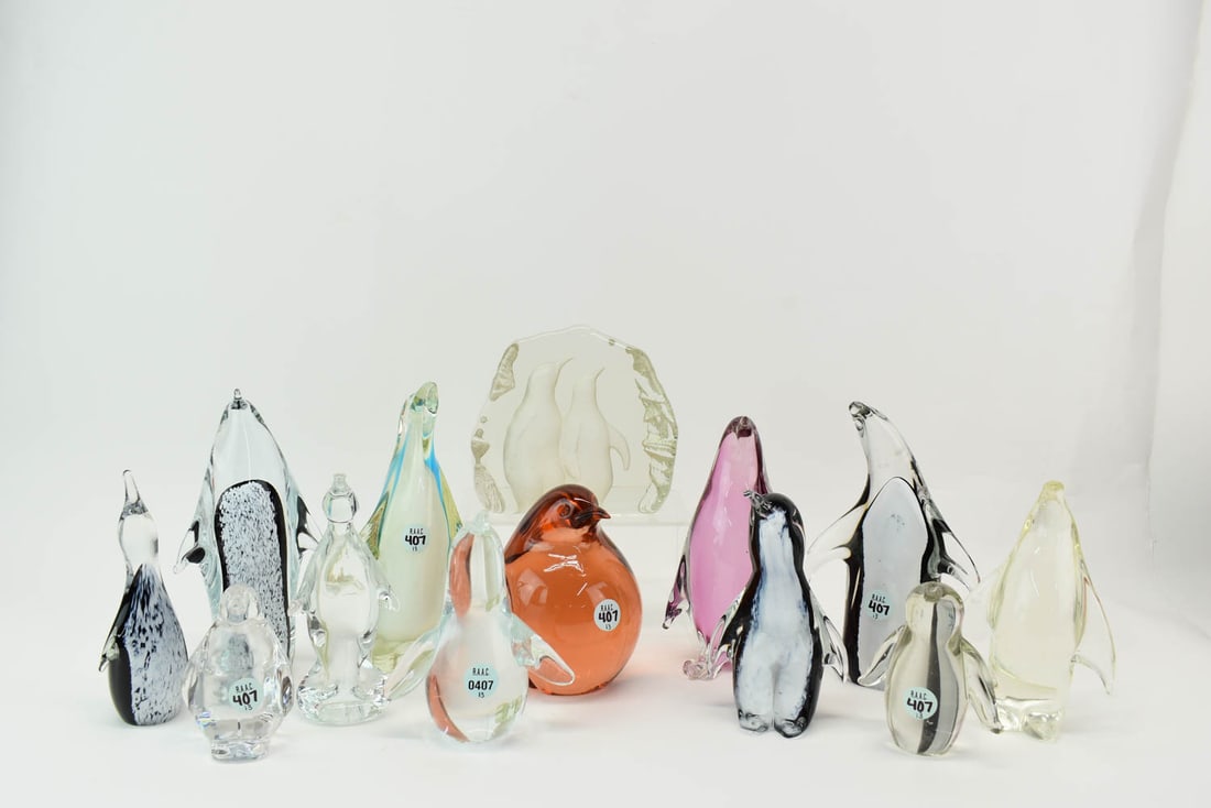 Thirteen Art Glass Penguin Figures: Thirteen Art Glass Penguin Figures, Italy/Sweden, 20th C., including makers by Livio Seguso.Oggetti and F.M. Konstglass Ronneby; clear, amber, and sommerso glass, some marked. Scratches, wear, chips, 