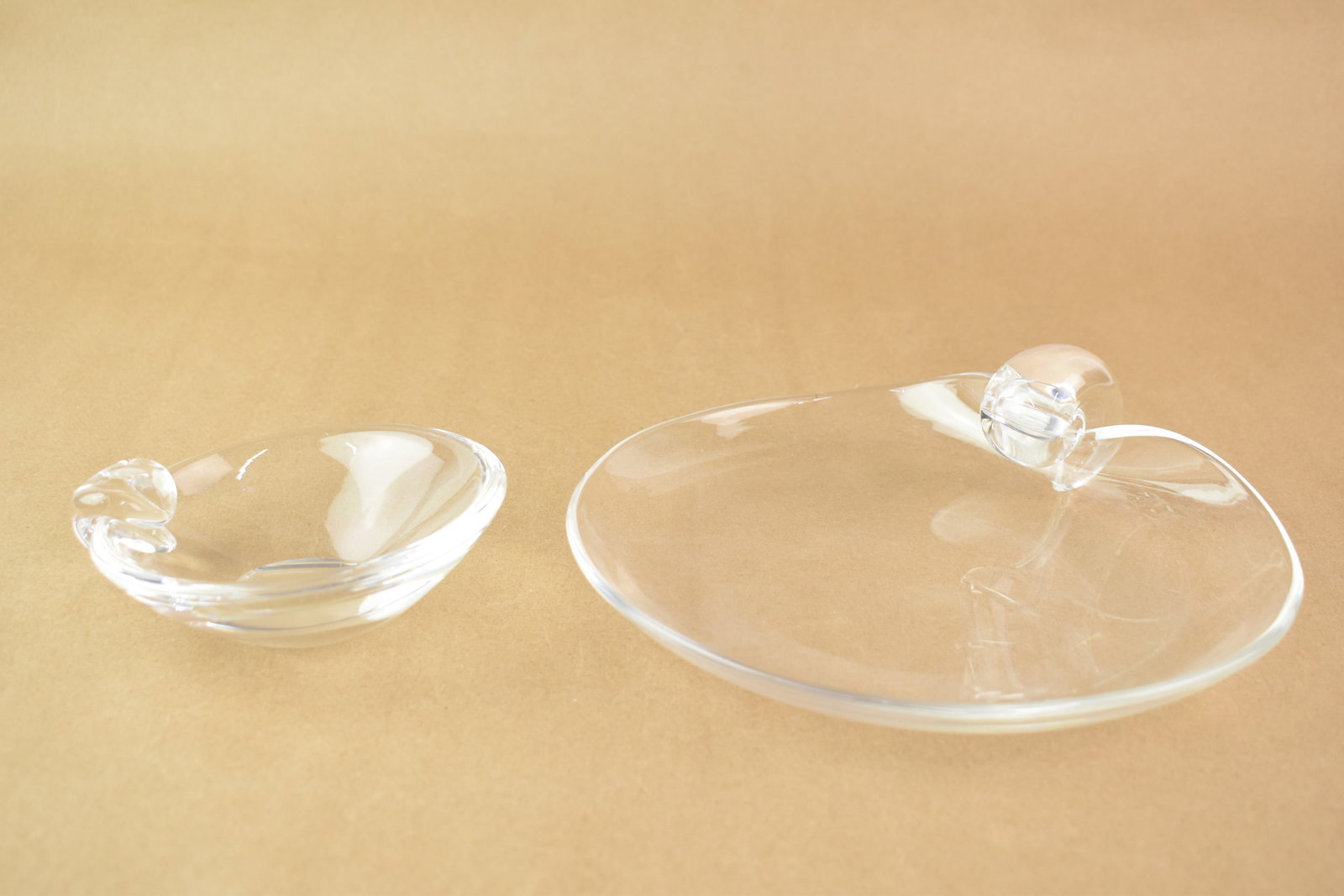 Steuben Dreves Platter and Thompson Bowl: Steuben John Dreves Small Dessert Platter and George Thompson Small Bowl, both signed "Steuben"; used condition; Platter measures approximately 9 1/8" wide x 3 1/4" tall, bowl measures approximately 5