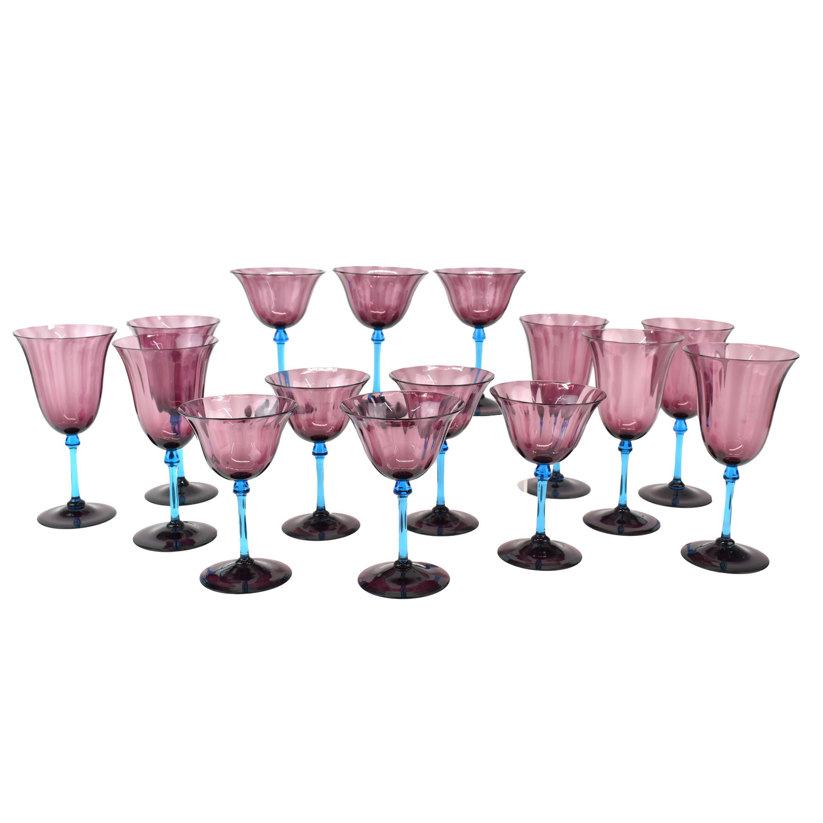 Set of Steuben Amethyst & Aqua Glass Stemware: Rare Set of Steuben Stemware Wine Glasses having Amethyst and Aqua Marine Stems. Some signed some unsigned. Used condition. Seven large wines measuring 7 5/8" tall, and 8 smaller wines measuring 6" ta
