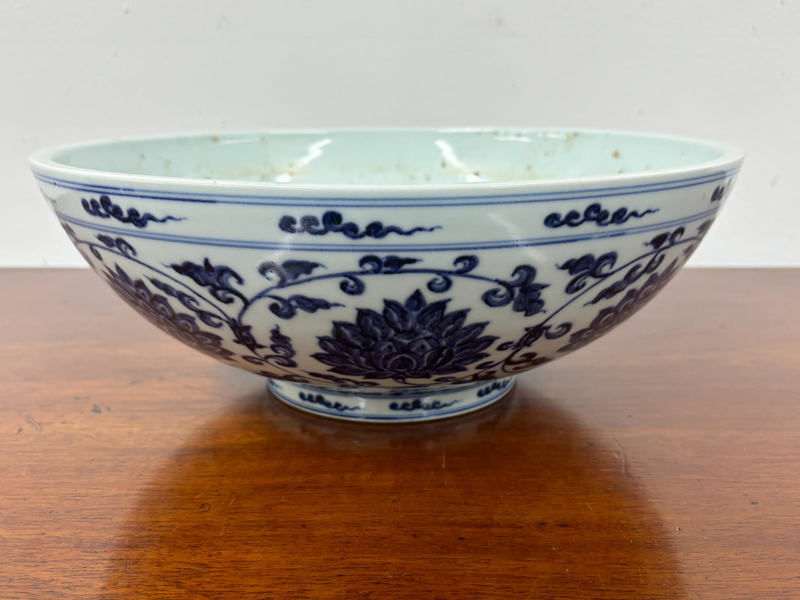 Asian Blue and White Decorated Center Bowl: Asian Blue and White Decorated Center Bowl Asian Blue and White Decorated Center Bowl. Has label on underside from the Dorothy Tapper Goldman Collection but we make no warranty's that this is there. U