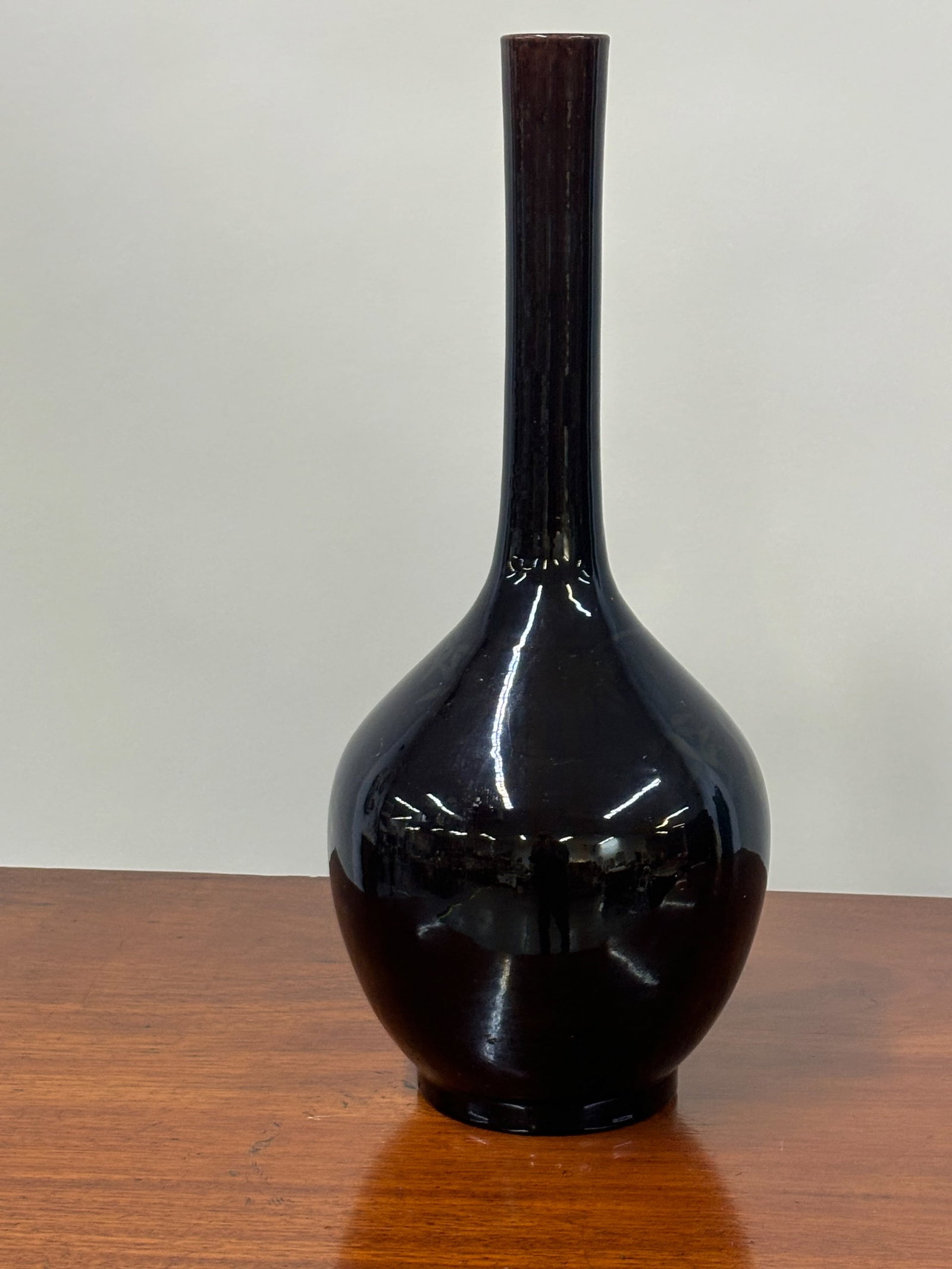 Chinese Black Glazed Crane Decorated Bottleneck Vase: Chinese Black Glazed Crane Decorated Bottleneck Vase Chinese Black Glazed Crane Decorated Bottleneck Vase, with cranes and bamboo underglaze. Used condition. 18"h x 7-1/2"dia.