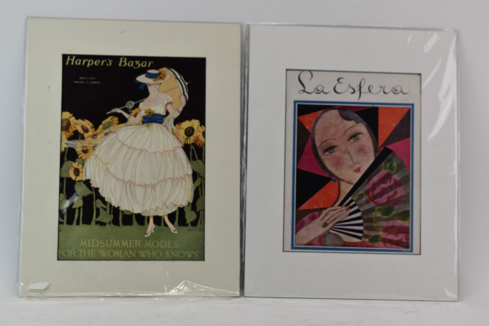 Harper's Bazar Cover Matted from July 1915: Harper's Bazar Cover Matted from July 1915Harper's Bazar Cover Matted from July 1915 together with a matted cover from La Esfera Magazine; used condition, creases, pencil marks on La Esfera; largest h