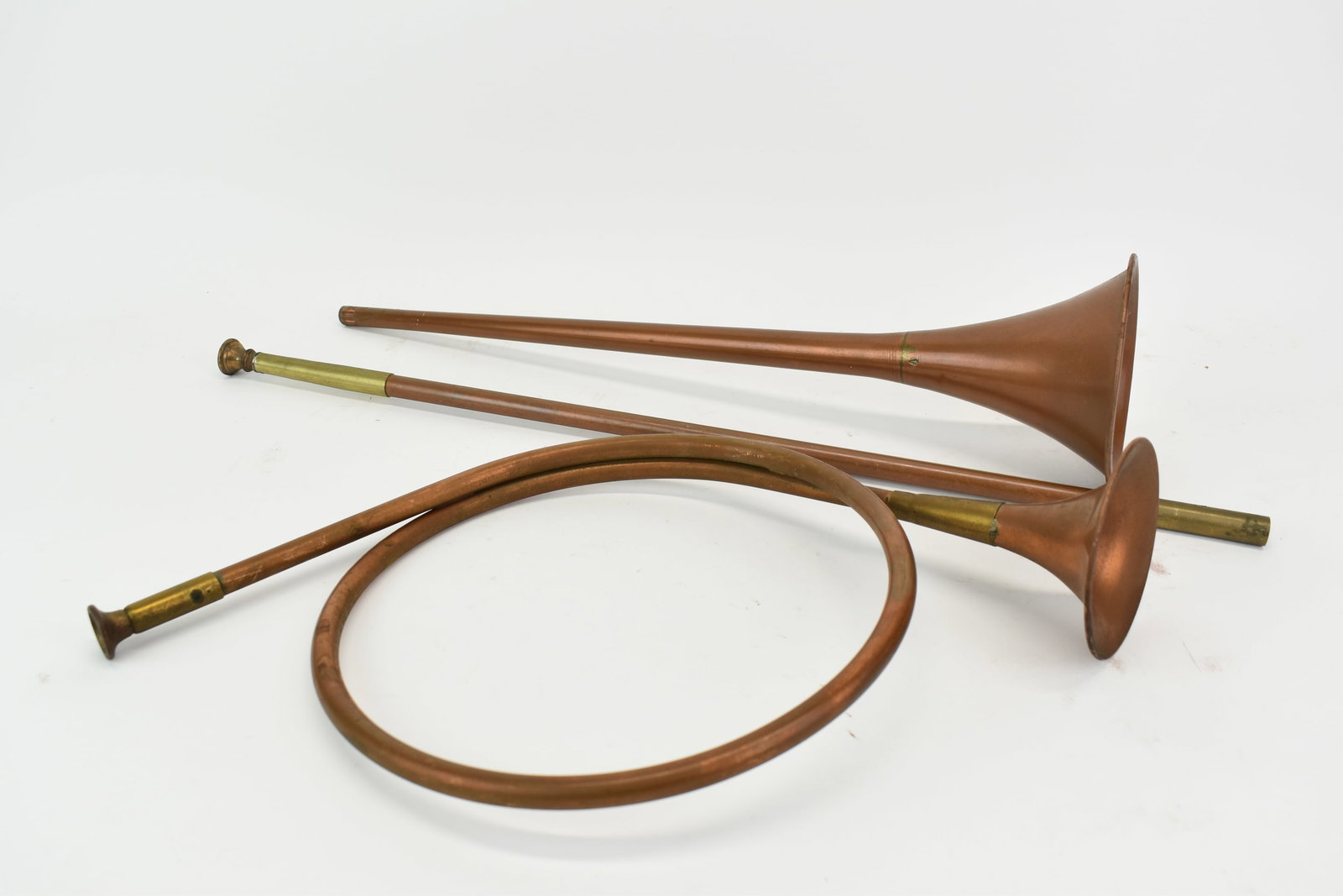 Vintage Copper and Brass French Horn: Vintage Copper and Brass French Horn Vintage Copper and Brass French Horn. Together with a copper and brass straight horn. Used condition, wear, worn, split to brass. Straight horn measures 41" l