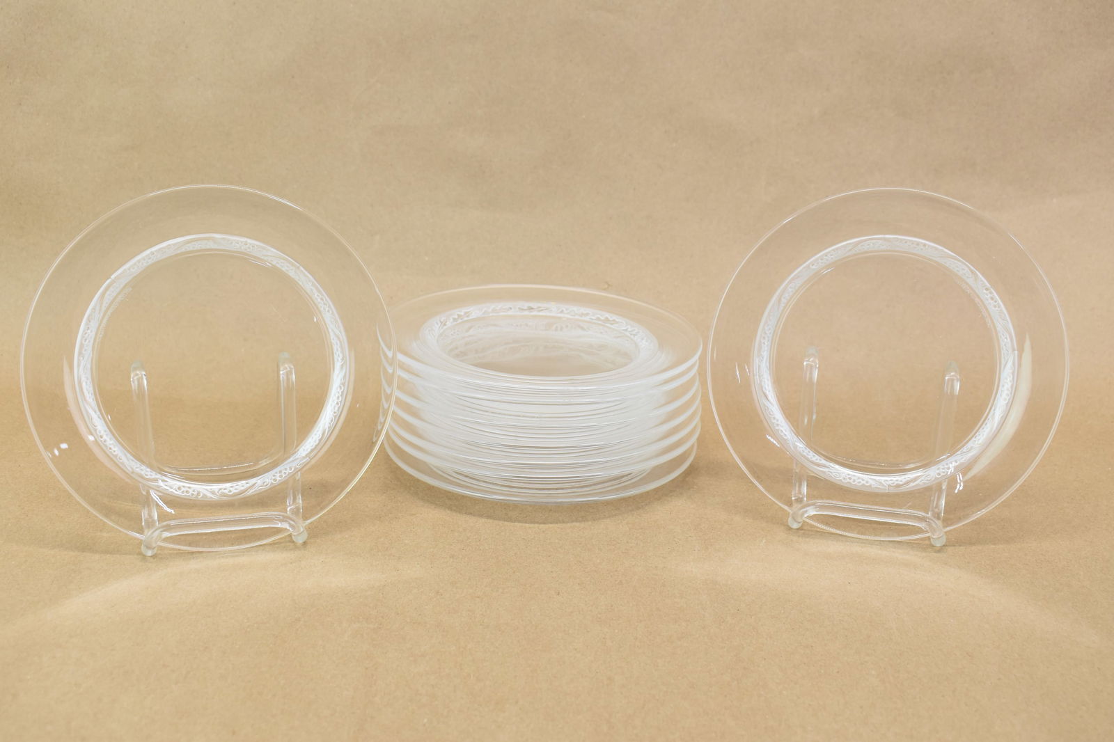 Nine Lalique Grape-Decorated Bread Plates: Nine Lalique Grape-Decorated Bread PlatesNine Lalique Grape-Decorated Bread PlatesSome wear.6-1/2"dia.