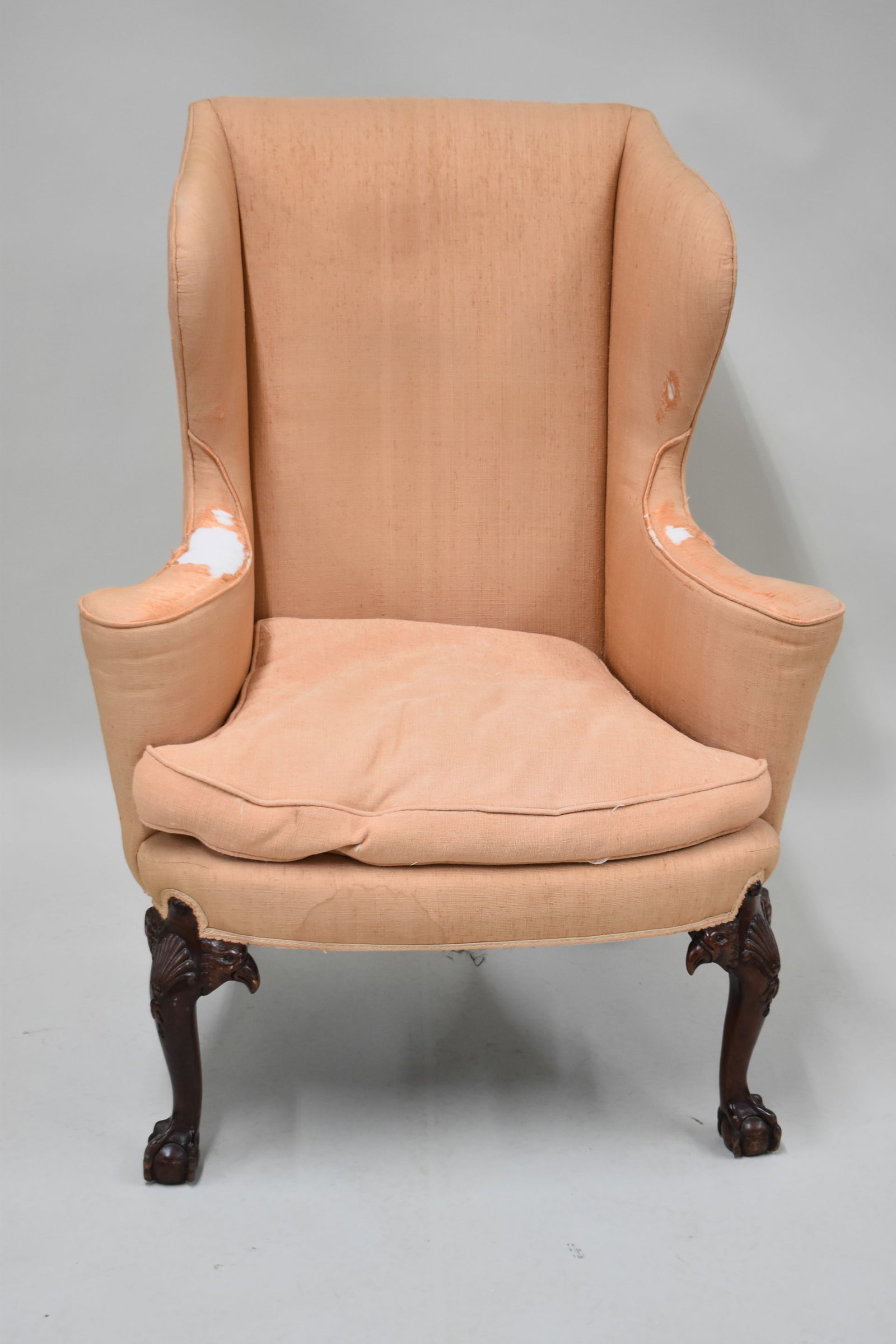 Chippendale Style Mahogany Upholstered Wingchair: Chippendale Style Mahogany Upholstered Wingchair Chippendale Style Mahogany Upholstered Wingchair. Used condition, wear, wear, losses to upholstery. 45" tall x 34" wide x 32" deep x 21&