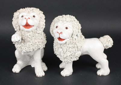 Two White-Glazed Ceramic Lions