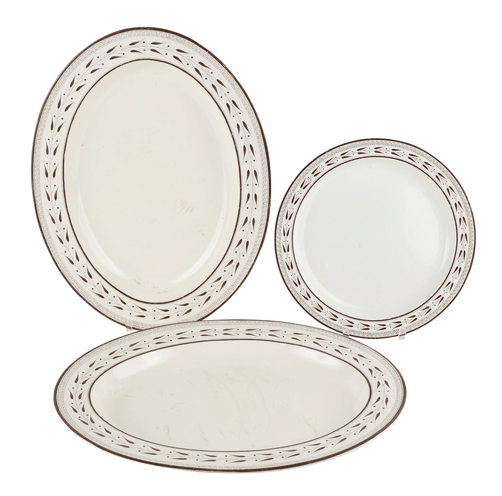 Three Wedgwood Creamware Platters: Three Wedgwood Creamware PlattersComprising, a circular example and two oval examples.Surface distress and wear.Provenance: Property from a Private New York Gentleman14-1/2"dia. and 22"w x 1
