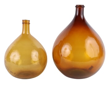 Two Amber Glass Wine Jugs