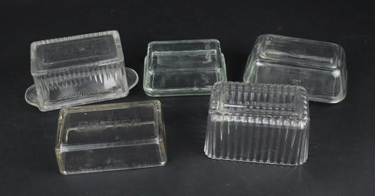 Five Colorless Glass Butter Dishes