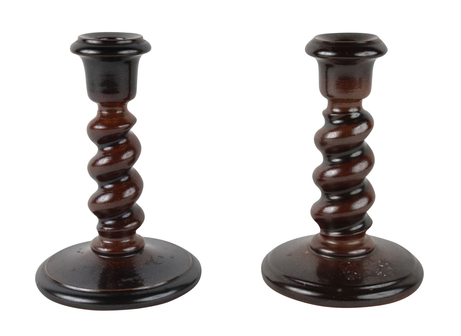 Pair of Brown Glazed Stoneware Candlesticks: Pair of Brown Glazed Stoneware CandlesticksEnglish, 19th C. Some surface distress.6-3/4"h x 4-1/2"dia.
