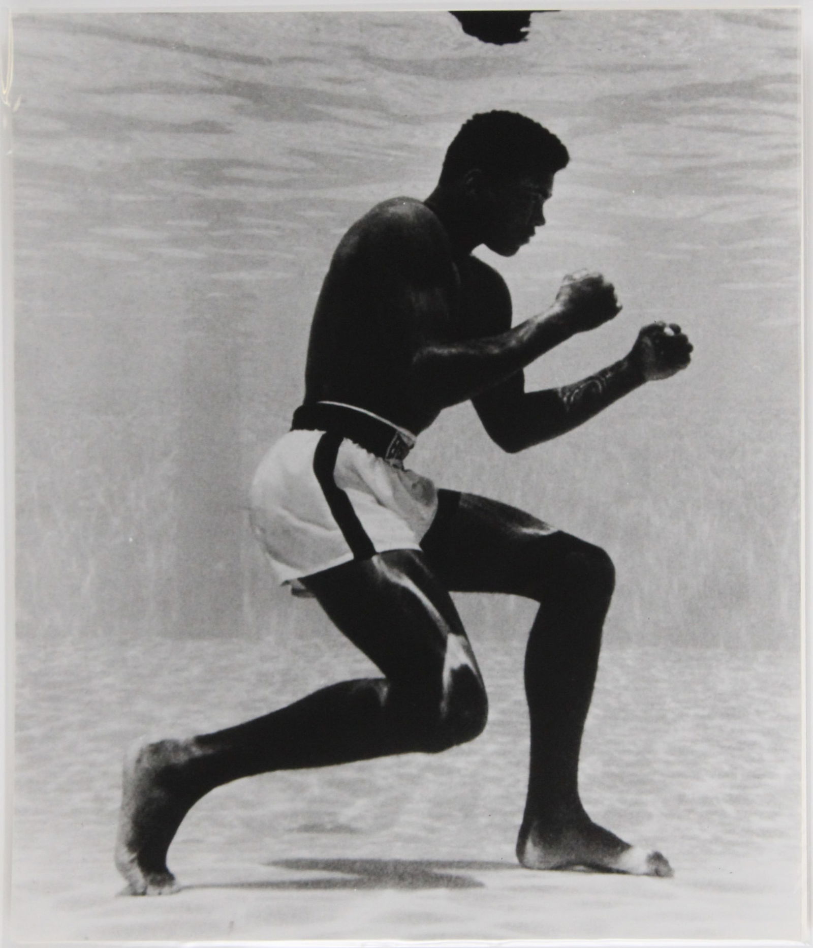 Flip Schulke, 1930-2008, Muhammad Ali Underwater at the Sir John Hotel Pool, Archival Pigment Print: Flip Schulke1930-2008Muhammad Ali Underwater at the Sir John Hotel PoolArchival Pigment PrintMiami, 1961, Flip Schulke, unframed.20 x 16 in. (50.8 x 40.6 cm.)