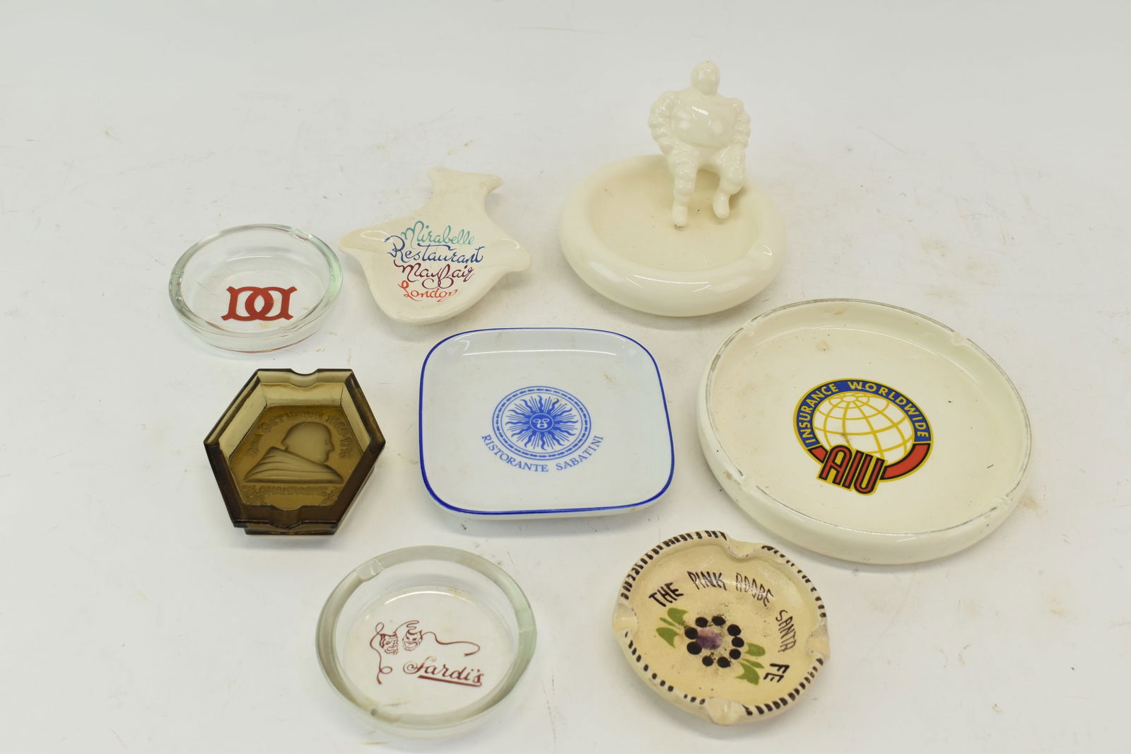 Vintage Group of Assorted Ashtrays: Vintage Group of Assorted AshtraysVintage Group of Assorted Ashtrays. Comprising Micheline Man, Dom Perignon, Insurance World Wide, Mirabelle Restaurant London, Ristorante Sabatini by Richard Ginori a