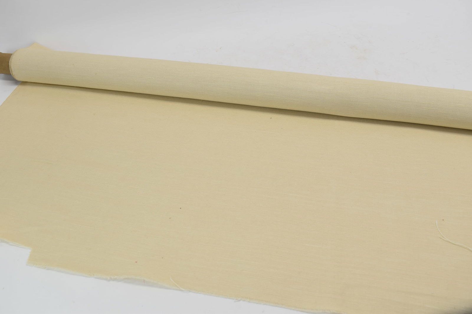 One Roll Brunschwig & Fils Tan Linen Fabric: One Roll Brunschwig & Fils Tan Linen FabricOne Roll Brunschwig & Fils Tan Linen Fabric; used condition, slightly musty scent; roll measures approximately 4 yards x 53 1/2"