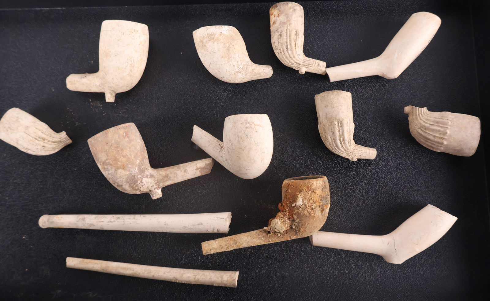 Nine Clay Pipes: Nine Clay PipesMost lacking stem, together with two stems.