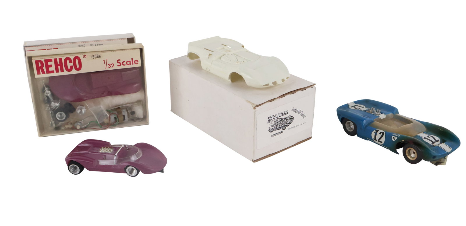 Five Slot Cars: Five Slot Cars Including, a cox lacucaracha and three Rehco purple cars, some not assembled.