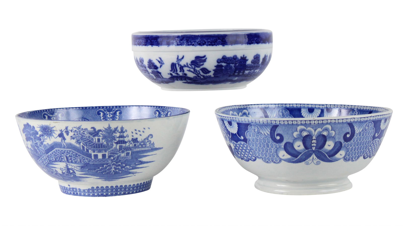 Three Blue-and-White Transfer Decorated Bowls: Three Blue-and-White Transfer Decorated BowlsComprising, a Minton salad bowl, a pearlware footed bowl, and a punch bowl. Hairline cracks, wear.Largest: 4-1/2"h x 9-3/4"dia.
