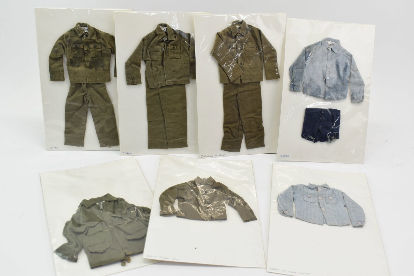 Vintage Hasbro GI Joe Soldier Japan Uniforms: Vintage Hasbro GI Joe Soldier Japan Uniforms Vintage Hasbro GI Joe Soldier Japan Uniforms, seven total, comprising three khaki workshirts with matching pants, one chambray shirt, another chambray shir