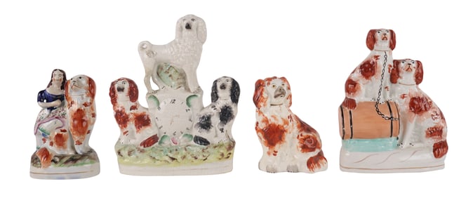 Four Staffordshire Pottery Dog Figurals