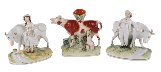 Three Staffordshire Pottery Figures with Cows