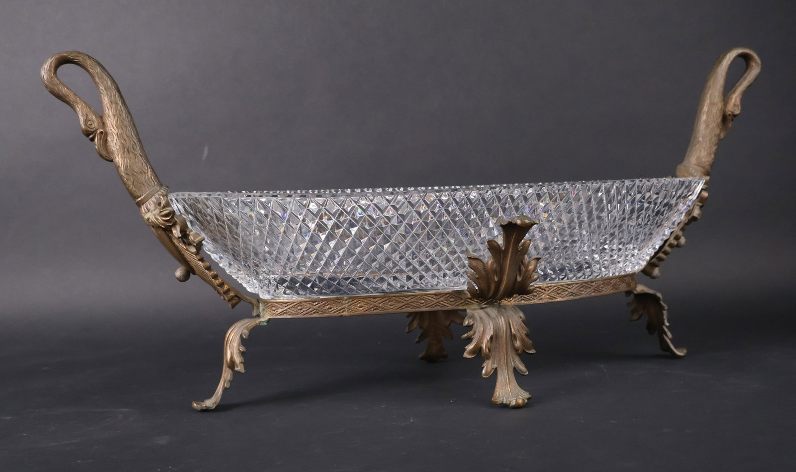 Beaux Arts Empire Style Cut Glass and Gilt Metal Centerpiece: Beaux Arts Empire Style Cut Glass and Gilt Metal Centerpiece Continental, the sides issuing two swans' neck handles. 11-1/2"h x 26"w x 10"d
