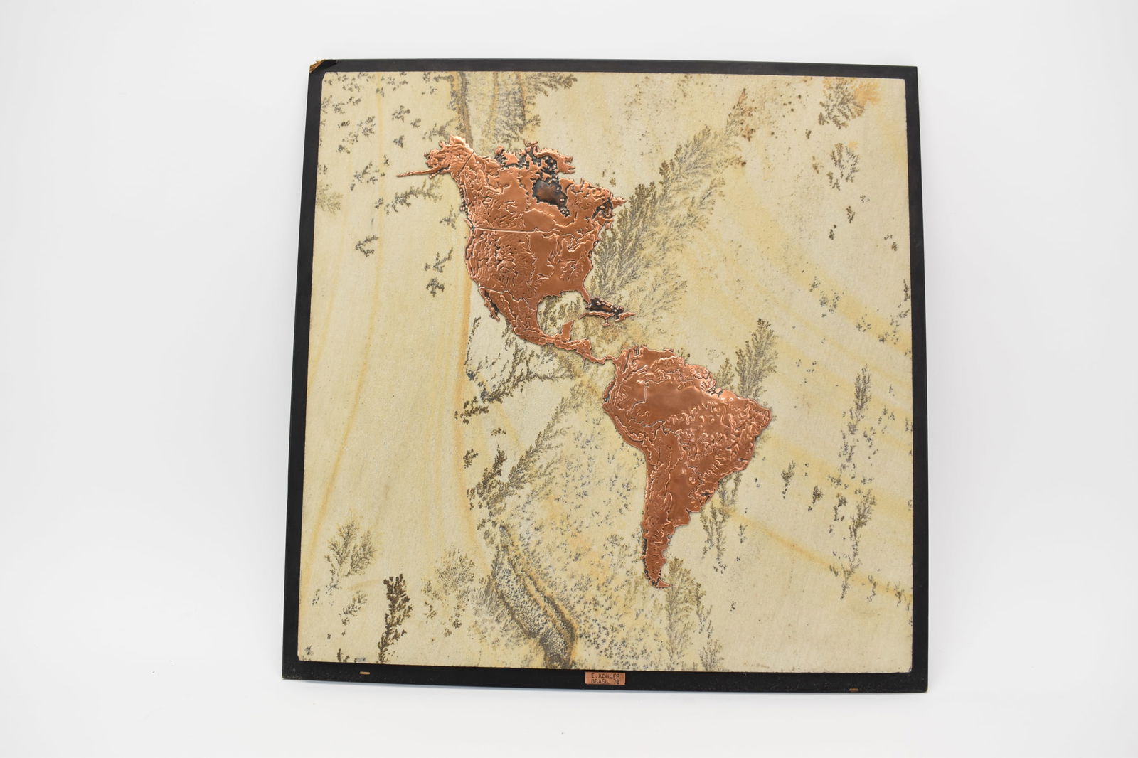 Vintage Copper Relief of The Americas: Vintage Copper Relief of The Americas, marked E. Kohler Brasil 78 on Sandstone, mounted on board. Used condition, wear, worn, chips to board. Overall size 20" x 20"