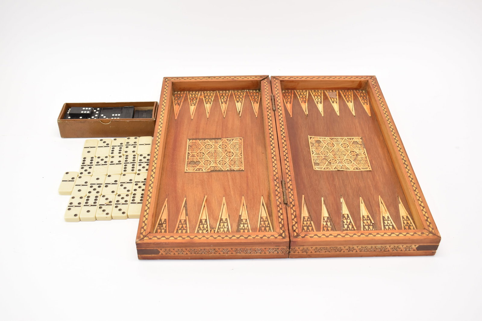 Group of Assorted Dominos and Moroccan Style Game Board: Group of Assorted Dominos and Moroccan Style Game Board. Used condition, wear, worn, losses. Game board box closed measures 3" tall x 8 3/4" x 18"