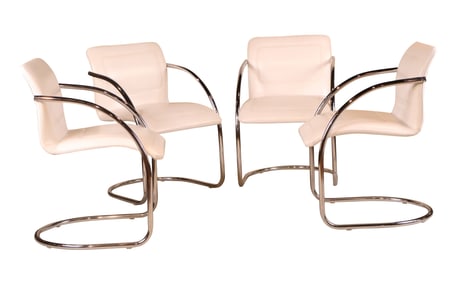 Four White Leather and Chrome Tubular Armchairs