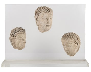 Three Cast-Stone Buddha's Heads