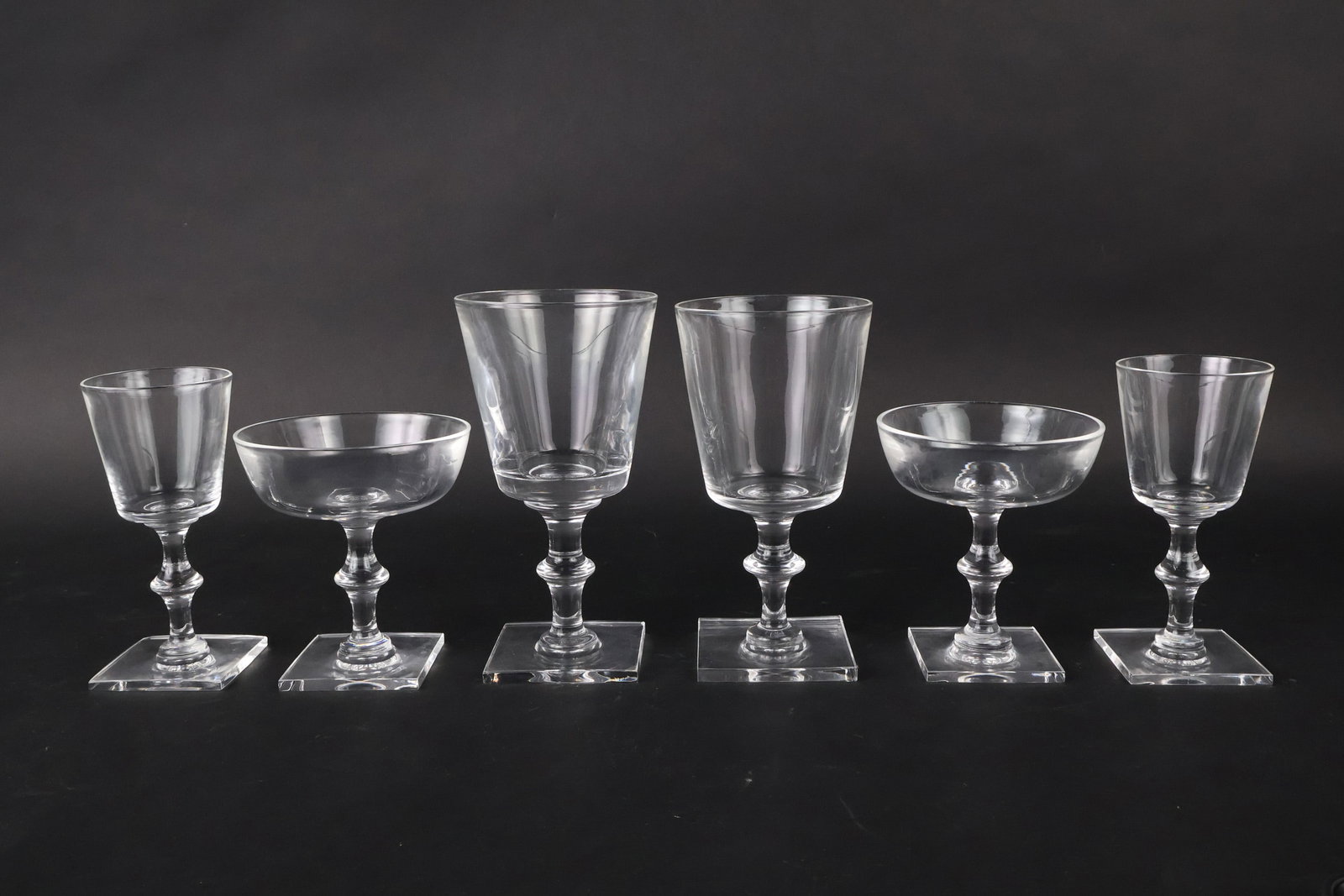 Group of Steuben Crystal Stemware: Group of Steuben Crystal Stemware Comprising, 10 wine glasses, 10 cordial glasses, and 12 champagne coupes. 32 pieces Provenance: Katharine duPont Weymouth, Greenville, DE 7 x 3 3/4 in. (17.8 x 9.5 cm