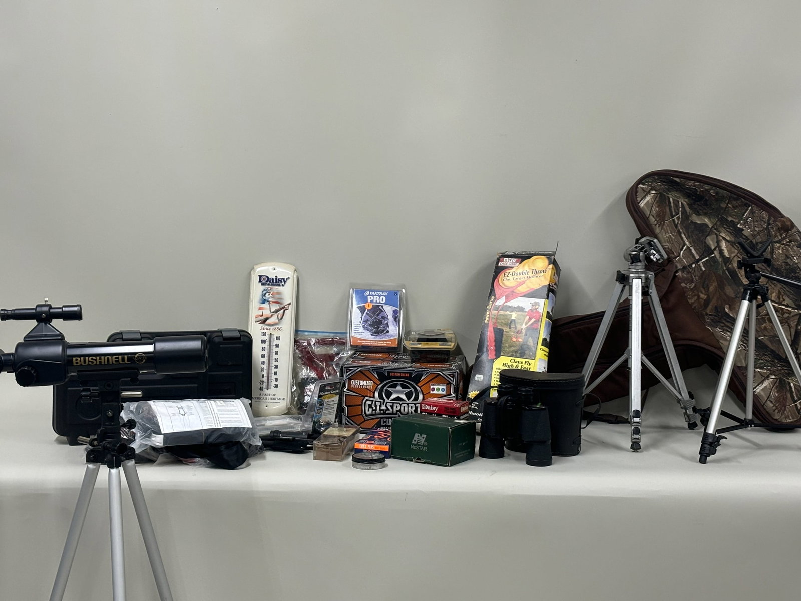 Group of Assorted Shooting Related Articles: Group of Assorted Shooting Related ArticlesGroup of Assorted Shooting Related Articles. Including NcSTAR laser red dot, Selsi 10x 50 Binoculars, Two Smith and Wesson Hard Pistol Cases, Camo cross bow