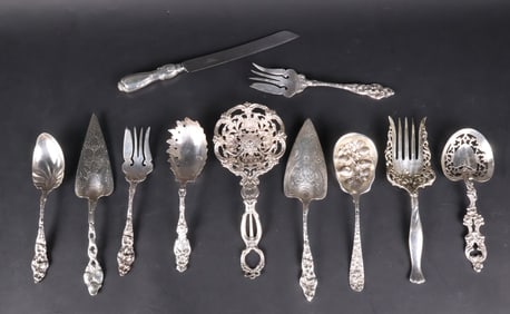 Eight Ornate Sterling Silver Serving Pieces