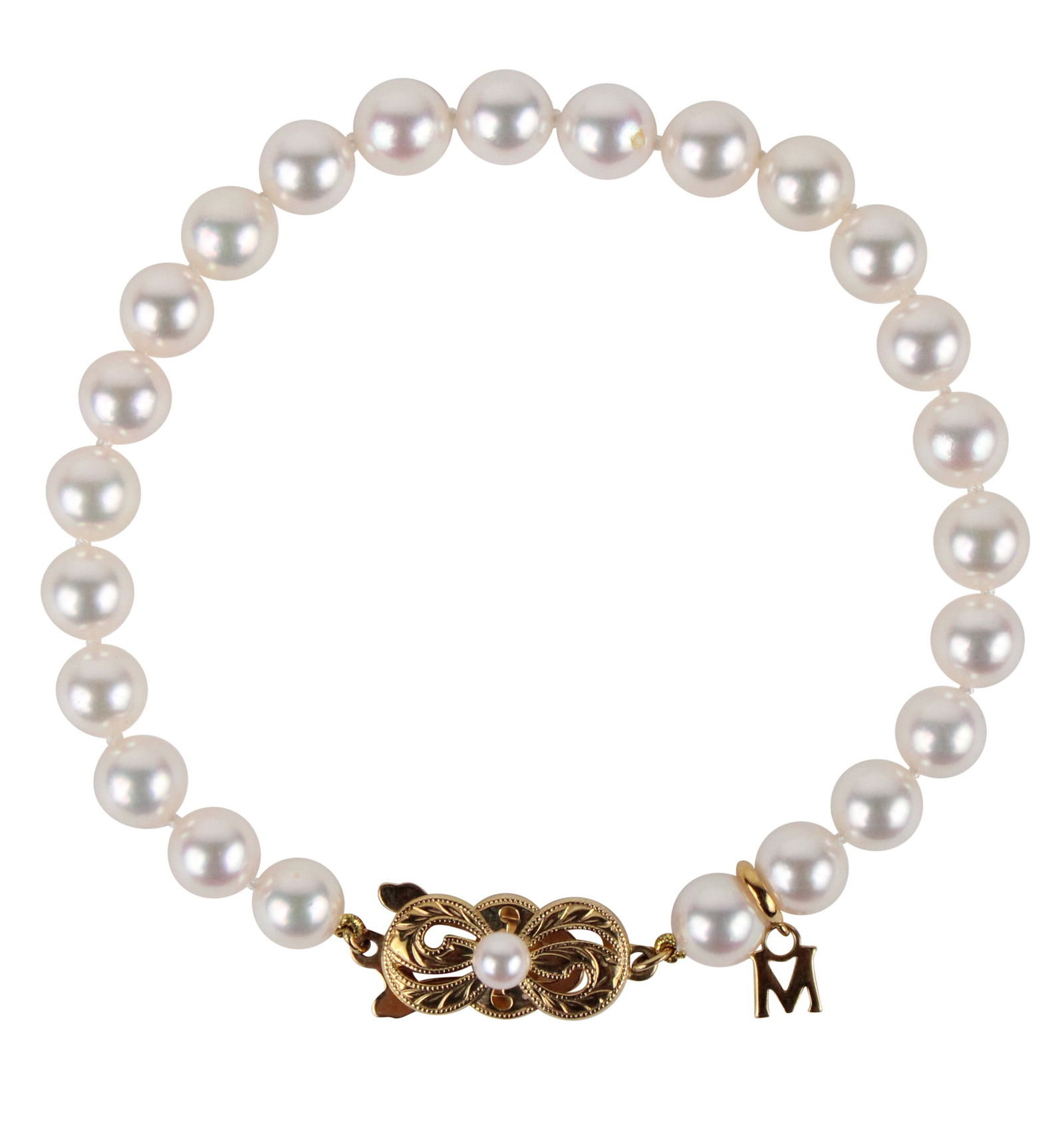 Mikimoto 18K Yellow Gold and Pearl Bracelet: Mikimoto 18K Yellow Gold and Pearl BraceletIn original box and pocket.x 7 in. ( x 17.8 cm.)