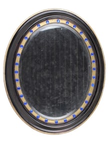 Regency Ebonized and Parcel-Gilt Oval Mirror