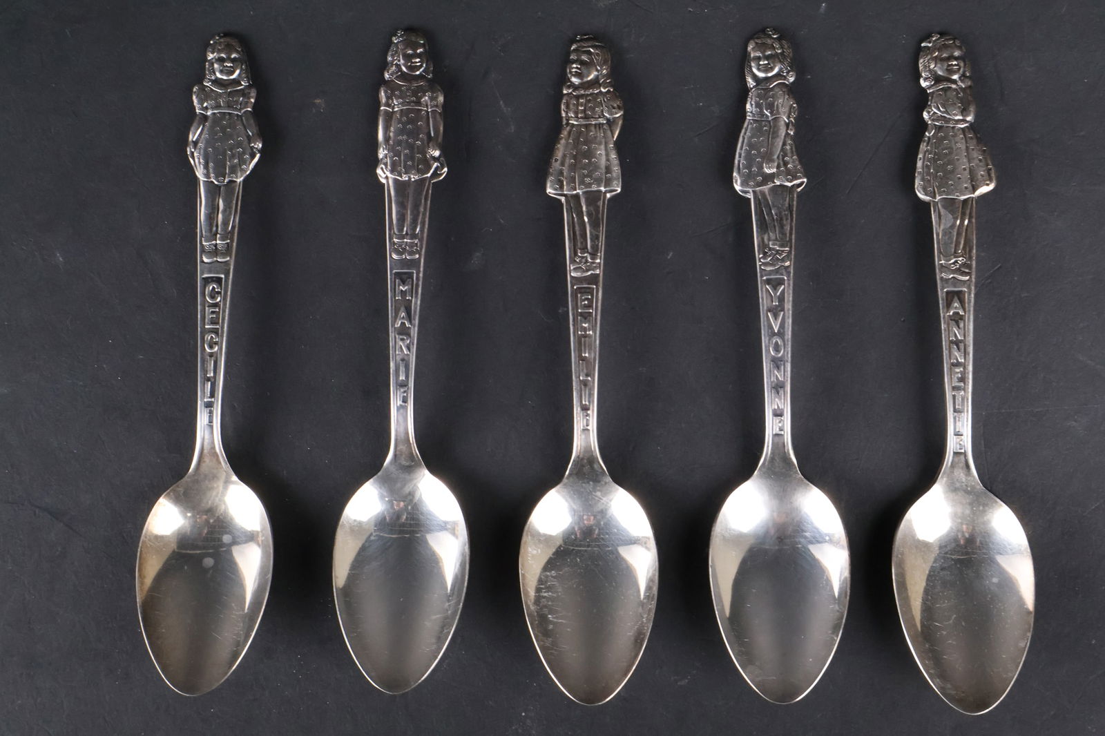 Group of Silver Plated Spoons Depicting Young Women