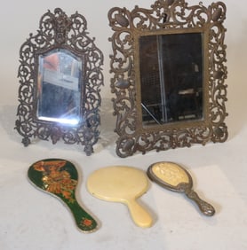Two Bronze Table Mirrors along with Three Handheld Makeup Mirrors