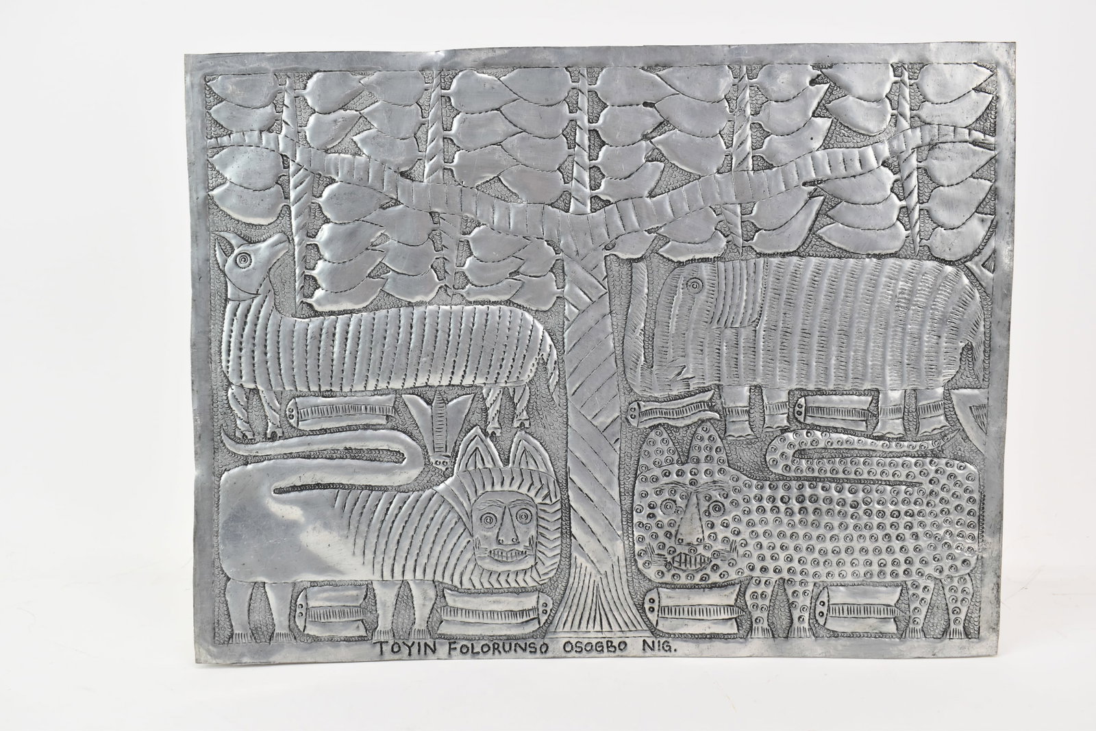 Toyin Folorunso Embossed Kingdom of Animals: Toyin Folorunso Embossed Kingdom of Animals Toyin Folorunso Embossed Kingdom of Animals. Hammered aluminum repoussé relief, Oshogbo, Nigeria. overall size 16 1/8” x 12”, used condition, b