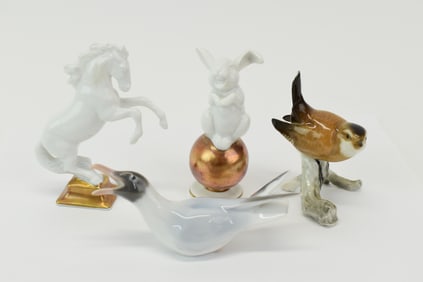 Group of Four Small Porcelain Figures