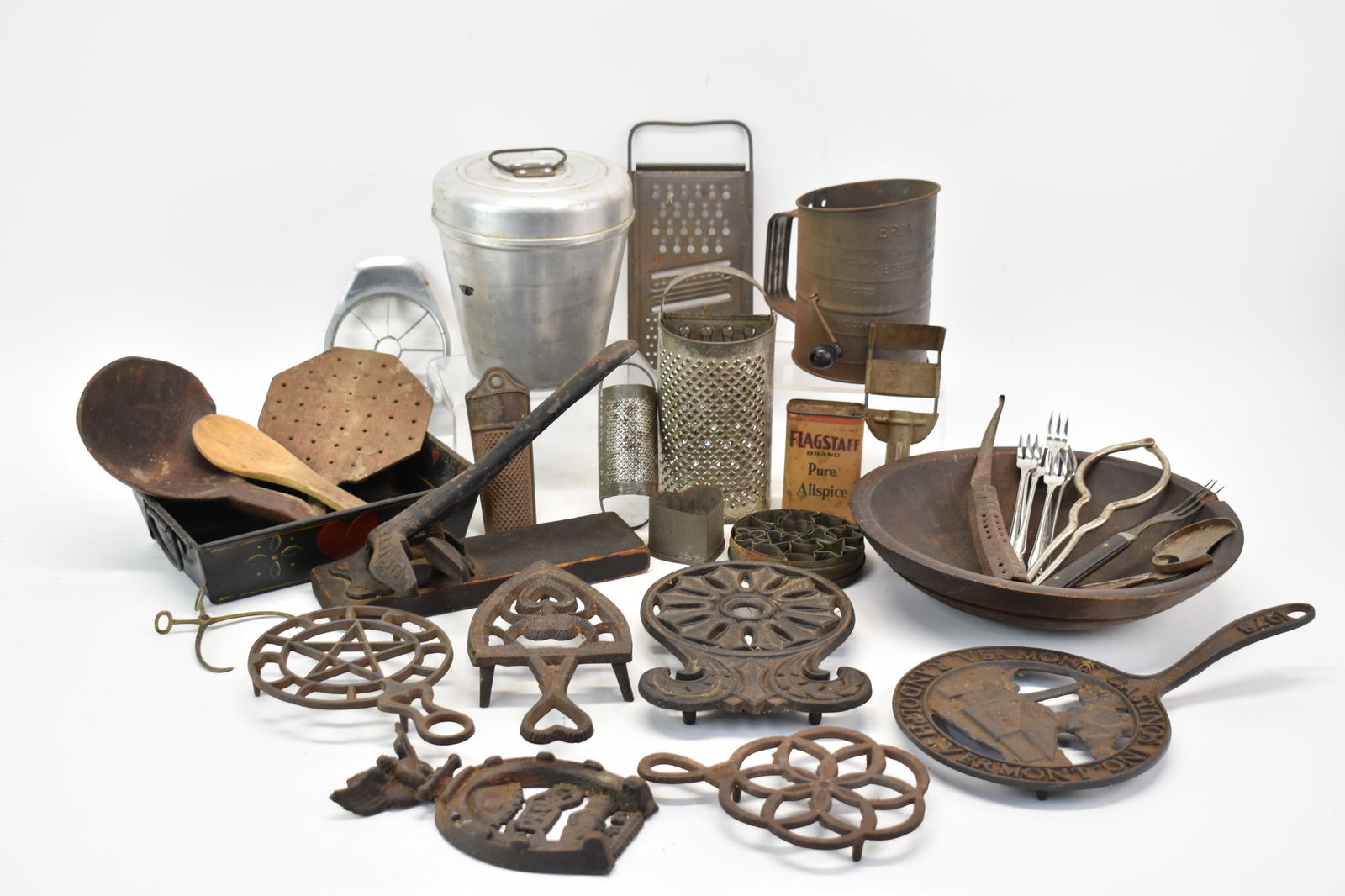 Group of Assorted Kitchen Articles: Group of Assorted Kitchen ArticlesGroup of Assorted Kitchen Articles. Including Iron Trivets, Toleware Heart decorated tray, Flagstaff Brand Tin, Sifter, grater, cookie cutters, Sargent & Co # 10 Cork
