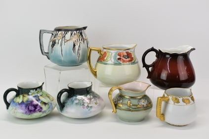 Seven Antique Lemonade Cider Pitchers