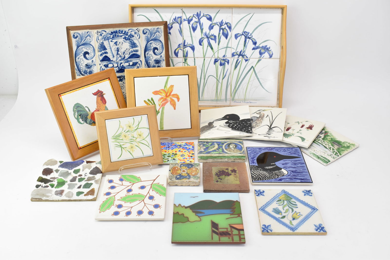 Group of Assorted Tiles and Trivets: Group of Assorted Tiles and TrivetsGroup of Assorted Tiles and Trivets including some by Maine and New Hampshire artists. Together with antique blue and white framed tiles, and a tile serving tray. Us