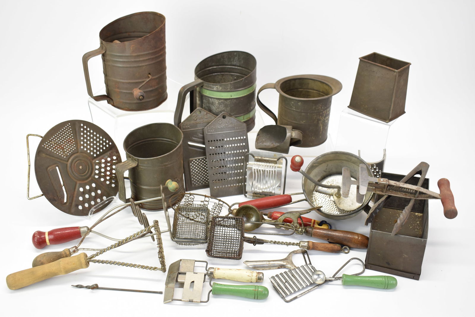 Group of Assorted Kitchen Articles: Group of Assorted Kitchen ArticlesGroup of Assorted Kitchen Articles. Including sifters, graters, mashers, ice cream scoop and more. Used condition.